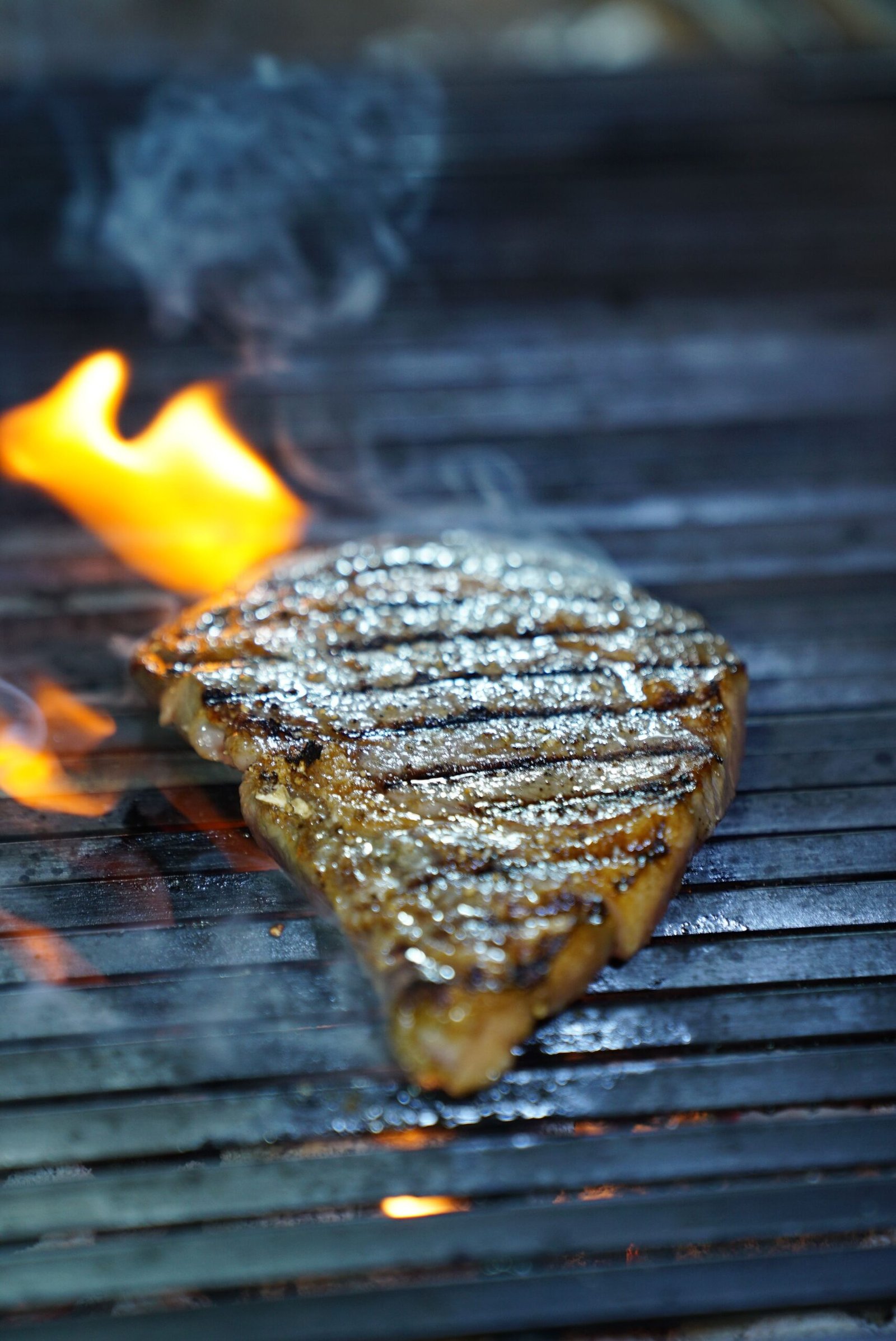 Steak searing over flames (alcatra)