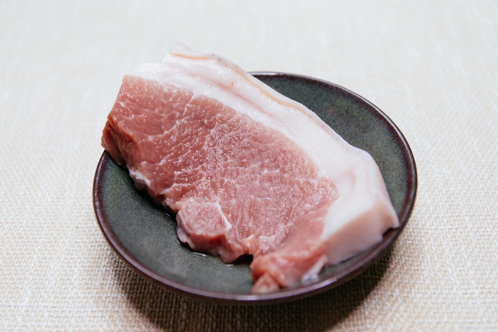 Raw pork picanha with a thick fat cap