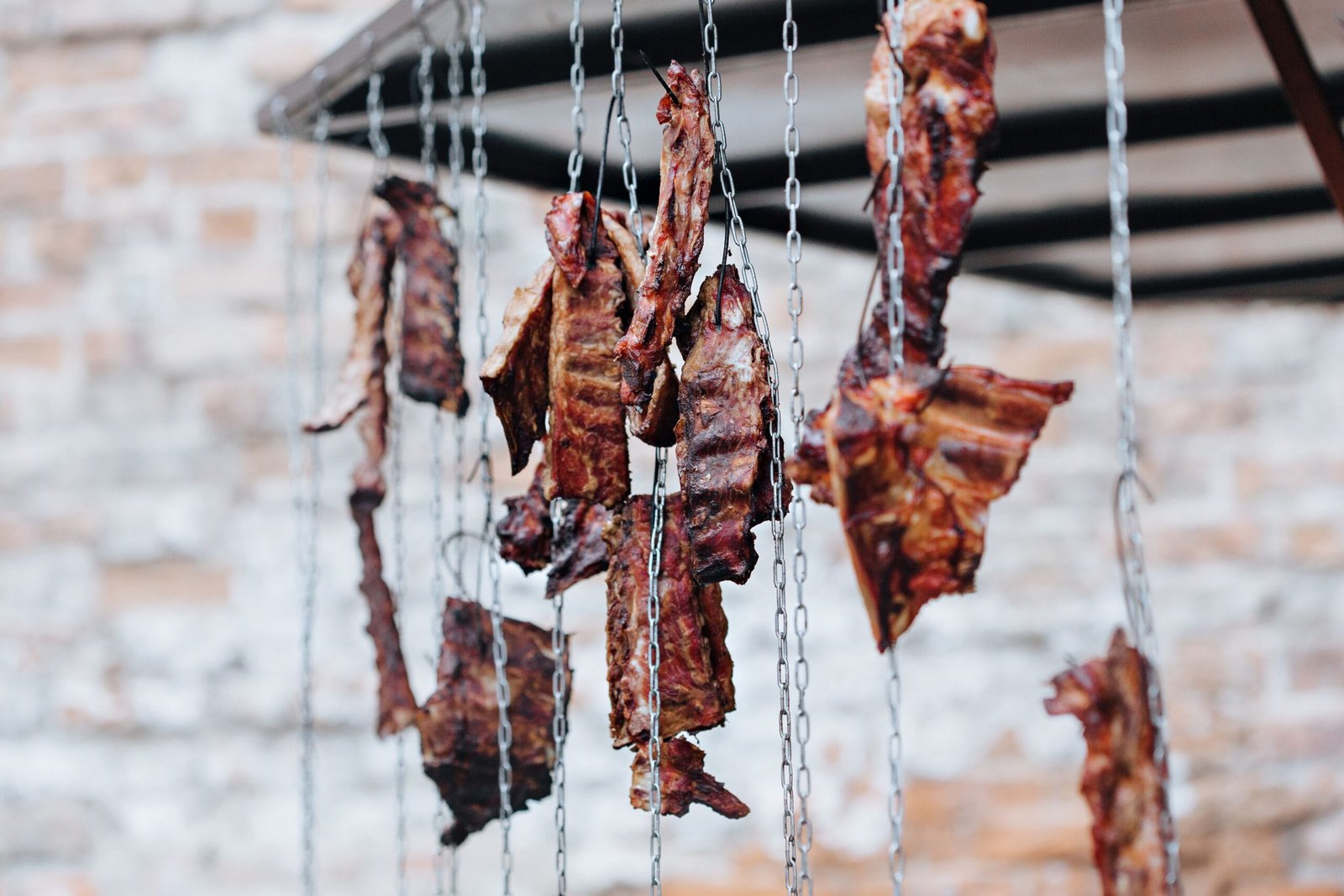 Large cuts of salted beef hanging to dry as carne de sol