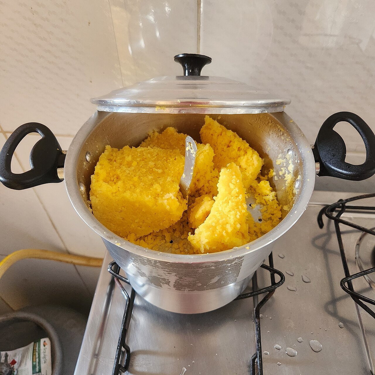 Steamed northeastern cuscuz in a cuscuzeira