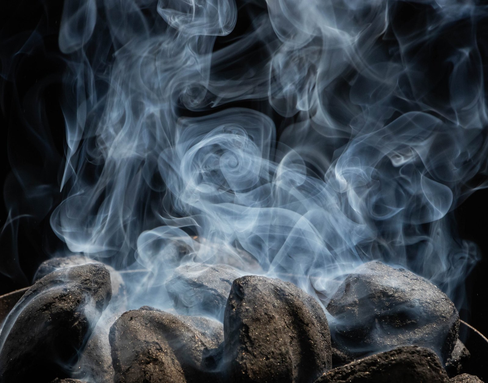 Charcoal being started in a grill