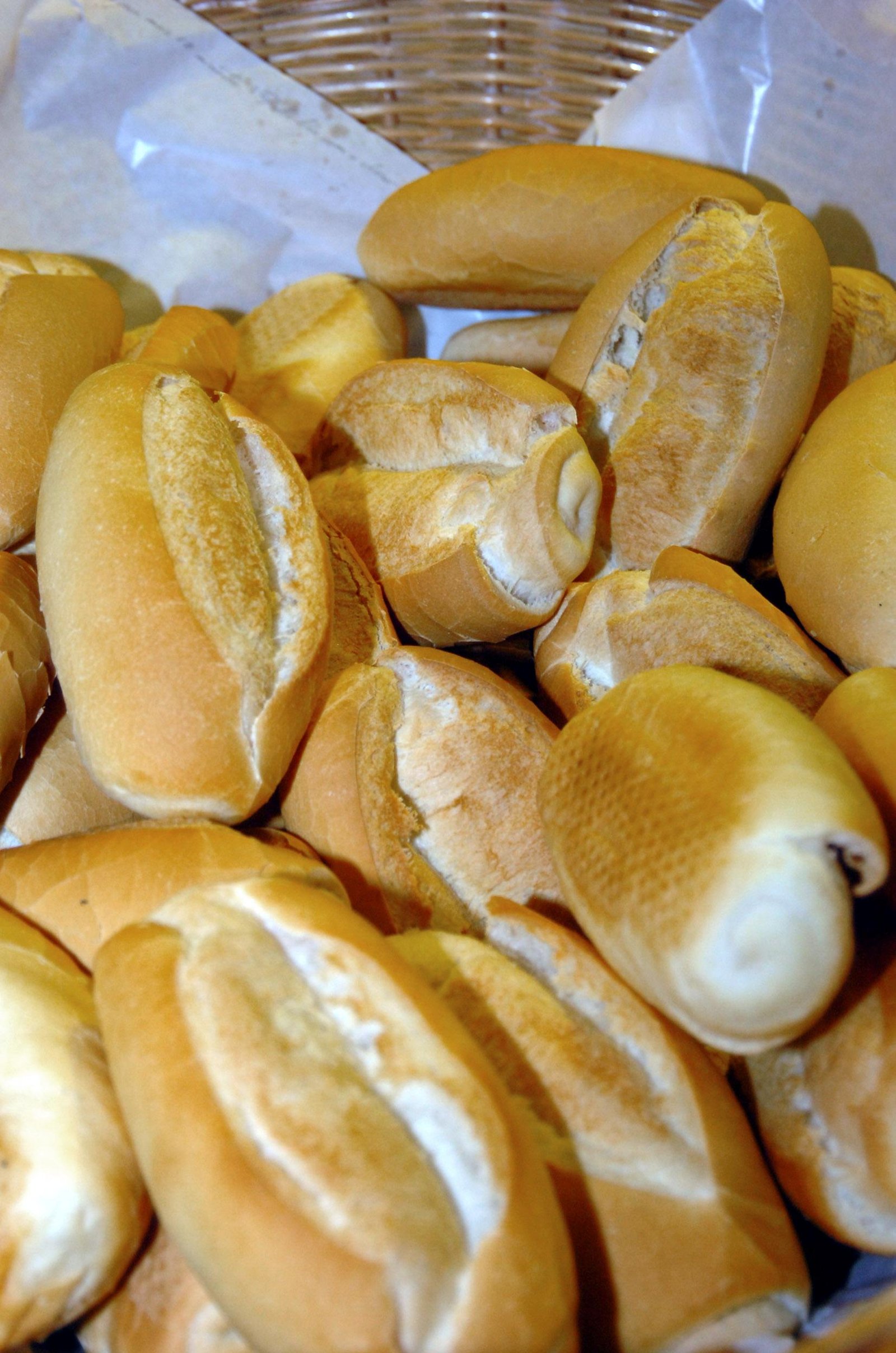 Brazilian French rolls (pão francês) in a basket