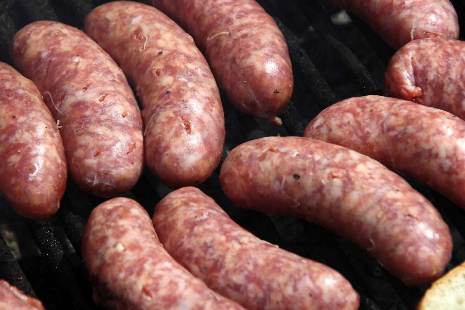 Raw linguiça sausages on a board
